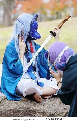 Marugame, Kagawa, Japan -  November 20, 2016: Young japanese girl dressed in cosplay costume at Mamugame-Jou Park. Photo taken in Marugame Cosplay Convention