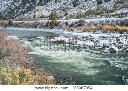 Rodeo Rapid on the upper Colorado River at Burns, Colorado, USA, looking upstream, winter scenery