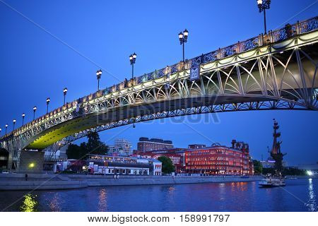 Beautiful Patriarchal Bridge and view of the Bersenevskaya promenade in the evening