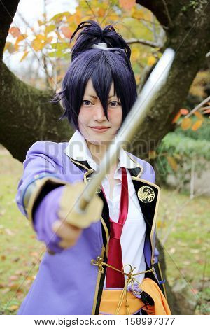 Marugame, Kagawa, Japan -  November 20, 2016: Young japanese girl dressed in cosplay costume at Mamugame-Jou Park. Photo taken in Marugame Cosplay Convention
