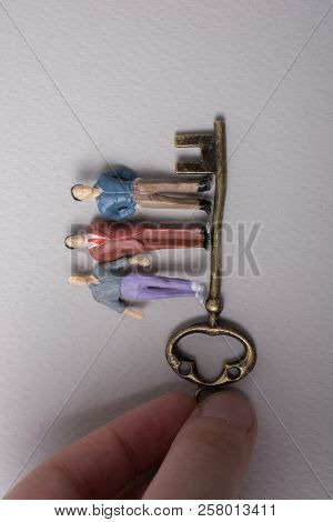 Tiny Figurine Of Man Miniature And Retro Key