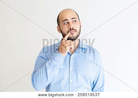 Sly Man Touching Mouth With Finger And Looking Away. Handsome Guy Thinking. Contemplation Concept. I