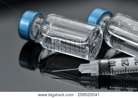 Tuberculin Syringe And Sterile Vial Filled With Medication Solution. An Injection Pharmaceutical Dos