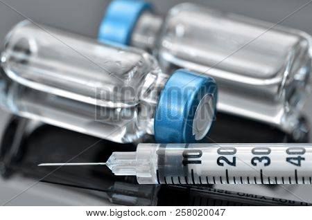 Tuberculin Syringe And Sterile Vial Filled With Medication Solution. An Injection Pharmaceutical Dos