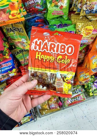 Plattsburgh, Usa - September 10, 2018: A Man Holding Haribo Happy Cola. Haribo Is A German Confectio