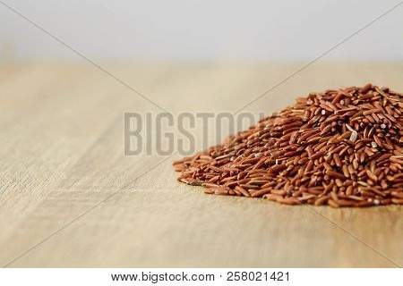 Red Rice In A Wooden