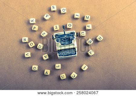 Letter Cubes Of Made Of Wood Around Model Typewritter