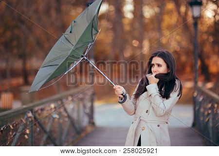 Girl Fighting The Wind Holding Umbrella Raining Weather