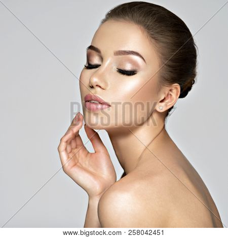 Closeup face of sexy beautiful young woman. Beauty treatment concept. Portrait of a pretty  caucasian girl with healthy skin.