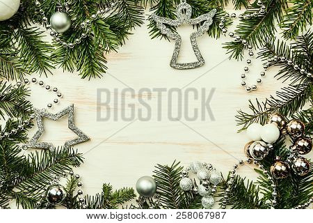 Christmas Composition With Fir Tree Branches And Christmas Decorations On White Wooden Background, T
