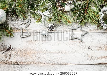 Christmas Composition With Fir Tree Branches And Christmas Decorations On White Wooden Background, T