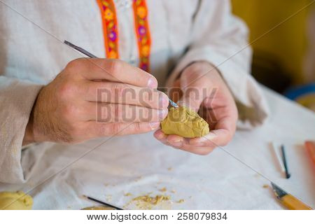 Potter Making Clay Figure For Board Game