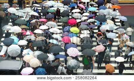 Tokyo, Japan - October 2017 : Undefined Japanese People Crowd Are Walking To Crosses The Street With