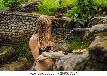 Young Woman Tourist In Belulang Hot Springs In Bali On The Background Of Rice Terraces
