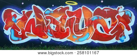 Full And Acomplished Graffiti Artwork. The Old Wall Decorated With Paint Stains In The Style Of Stre