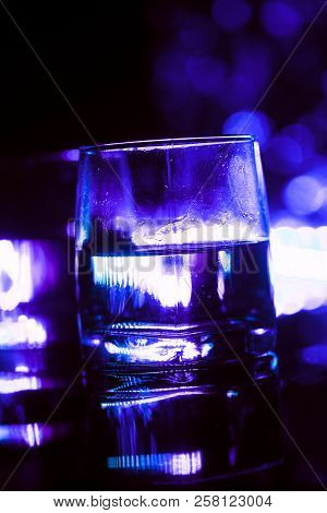 Colored Lighting Of Glasses In The Night Club Bar