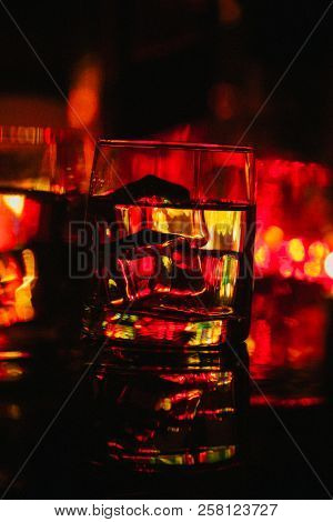 Colored Lighting Of Glasses In The Night Club Bar