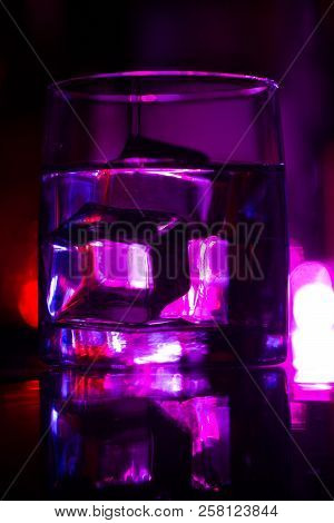 Colored Lighting Of Glasses In The Night Club Bar