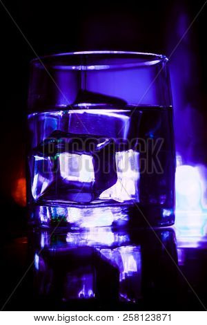 Colored Lighting Of Glasses In The Night Club Bar