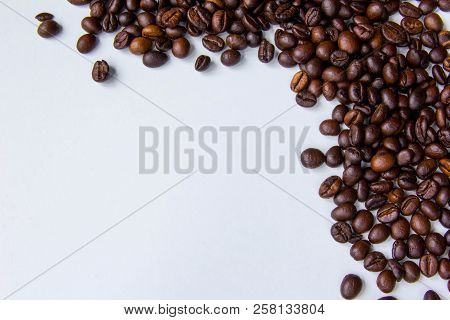 Copy Space Picture. Frame Of Coffee Beans At Right Upper Corner. White Background. Empty Place For P