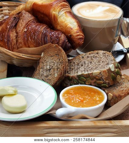European Breakfast - Coffee, Croissants, Toasts, Butter, Jam