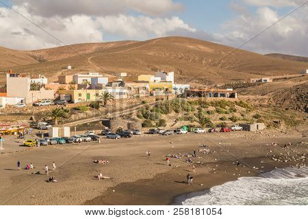 AJUY, FUERTEVENTURA, - 19 FEBRUARY 2018: View of sandy beach and village of Ajuy, Fuerteventura, Canary Islands, Spain.