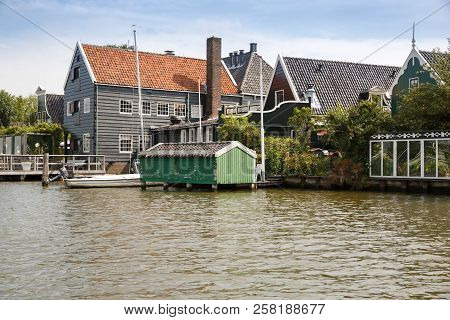 Traditional, Authentic Dutch Houses And Boat At The Canal.