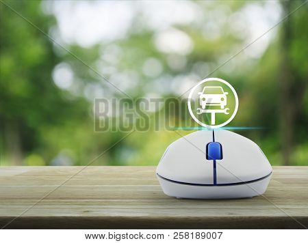 Service Fix Car With Wrench Tool Flat Icon With Wireless Computer Mouse On Wooden Table Over Blur Gr