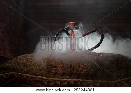 Hookah Hot Coals On Shisha Bowl Making Clouds Of Steam At Arabian Interior. Oriental Ornament On The