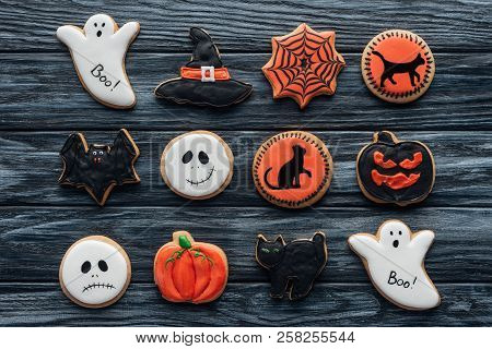 Elevated View Of Composition With Sppoky Halloween Cookies On Wooden Table