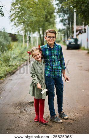 Funny Smiling Girl With Red Tights Tress Calm Boy Green Shirt  Embrace Hug