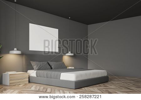 Corner Of Gray Wall Minimalistic Bedroom With A Wooden Floor, A Masterbed Standing On It And Night S