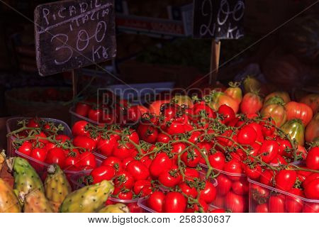 Heaps Of Fresh Tomatoes At A Farmers Market In Ventimiglia Italy