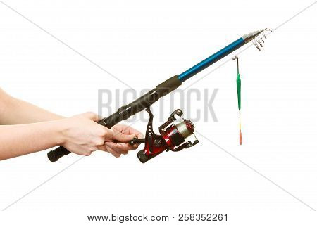 Spinning Sport Equipment Concept. Person Holding Fishing Rod With Float And Waggler With Line.