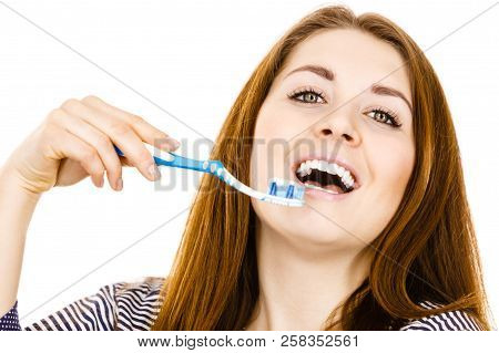 Woman Wearing Dressing Gown Holding Toothbrush With Paste On It. Smiling Positive Girl Ready To Clea