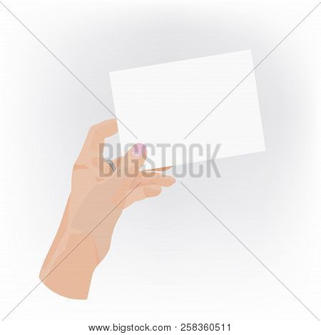 Woman's Hand Holds A Piece Of Paper.