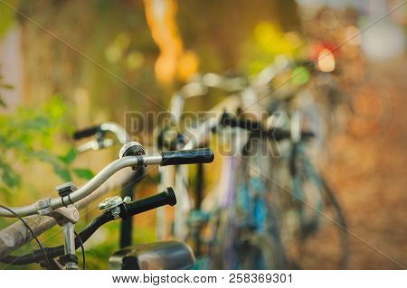 Old Bikes Near Raills On City Street. Sunset Time. Autumn Season. Bremen, Germany