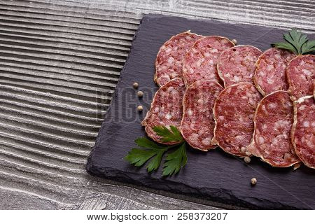 Saucisson Sec Delicious French Salami On A Wooden Background