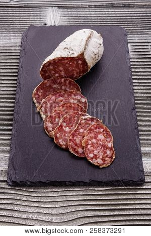 Saucisson Sec Delicious French Salami On A Wooden Background