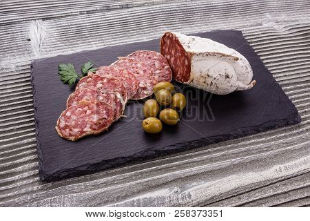 Saucisson Sec Delicious French Salami On A Wooden Background