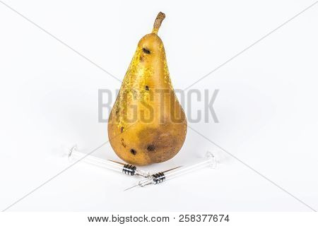 Close-up Boring Trace Of A Codling Moth Cydia Pomonella, In A Wormy Pear. On White Background. With 