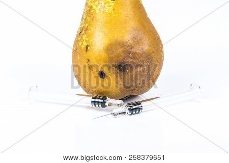 Close-up Boring Trace Of A Codling Moth Cydia Pomonella, In A Wormy Pear. On White Background. With 
