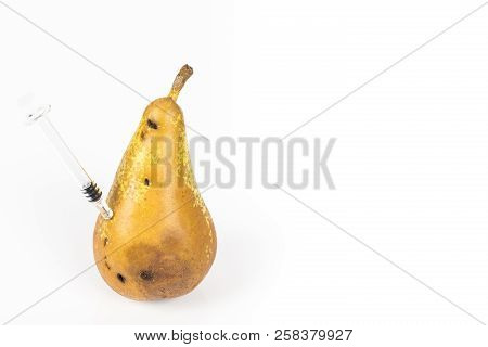 Close-up Boring Trace Of A Codling Moth Cydia Pomonella, In A Wormy Pear. On White Background. With 