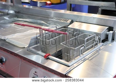 New Empty Modern Professional Fryer Basket In Kitchen Restaurant ; Food Industy