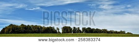 Landscape With Trees And Blue Sky On A Summers Day