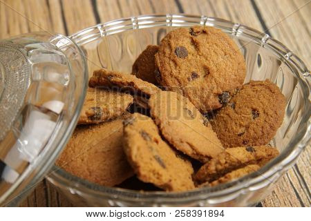 A Bowl Of Choco Chips Cookies On White Wooden Table
