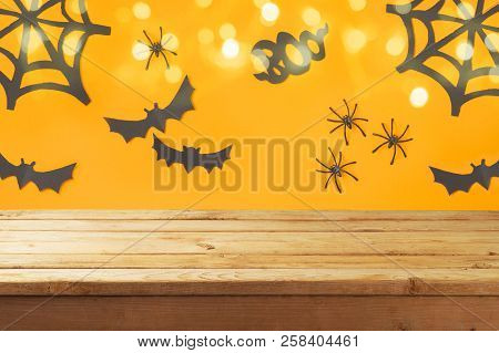 Empty Wooden Table Over Halloween Holiday Decorations Background With Bokeh Lights
