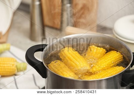 Stewpot With Boiling Water And Corn Cobs, Closeup