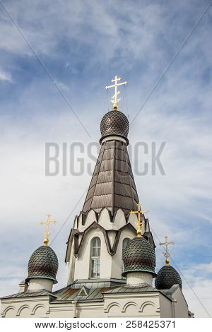 Golden Cross On The Dome Of The Temple. Gold Cross On A Blue Sky