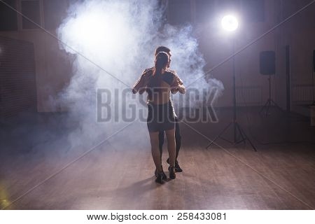 Young Couple Dancing Social Danse Kizomba Or Bachata Or Semba Or Taraxia In Dancing Class Background